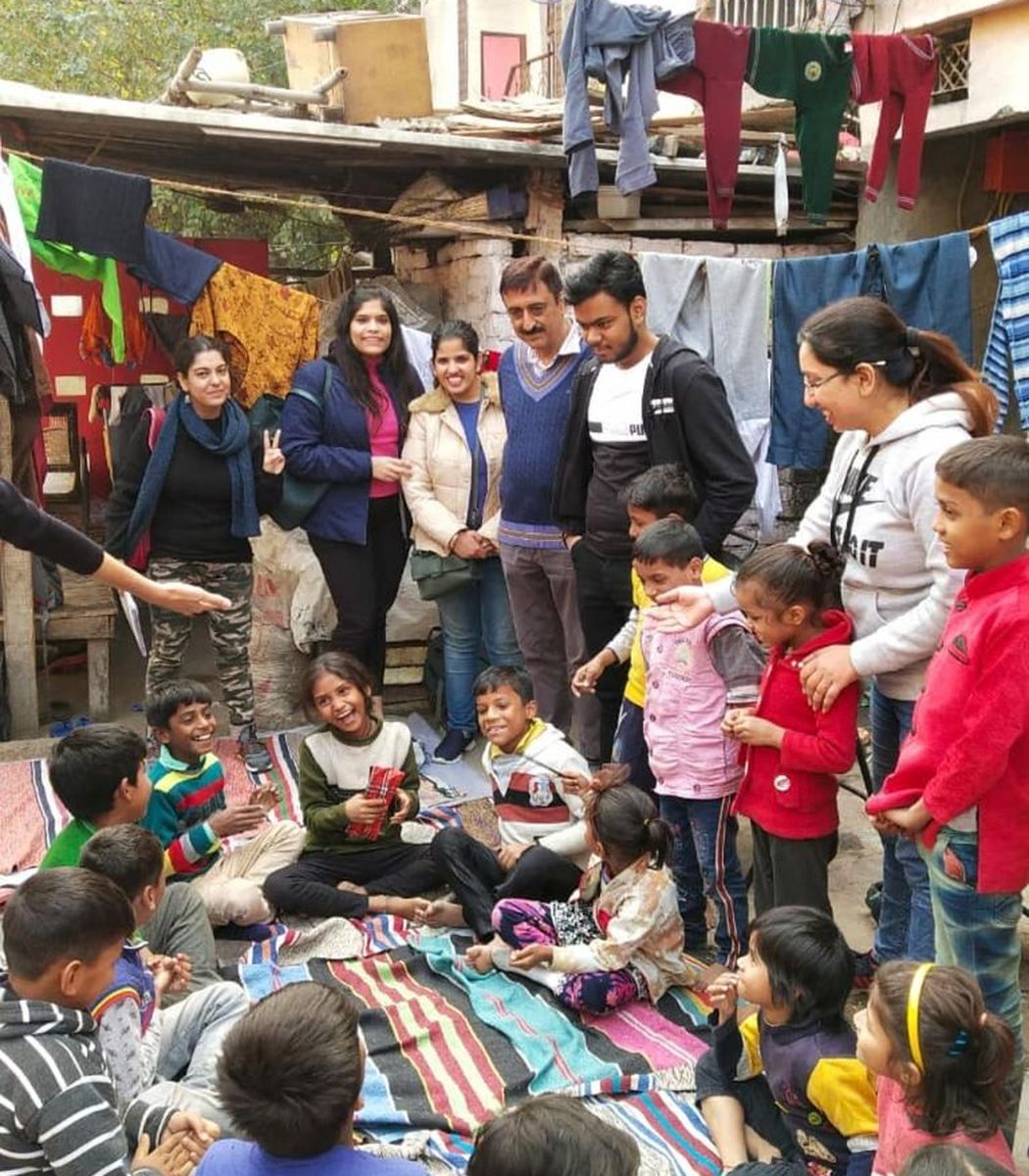 Our team laughing together with the children after a class