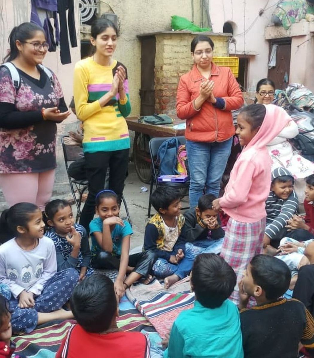 Volunteers cheering on students during an activity
